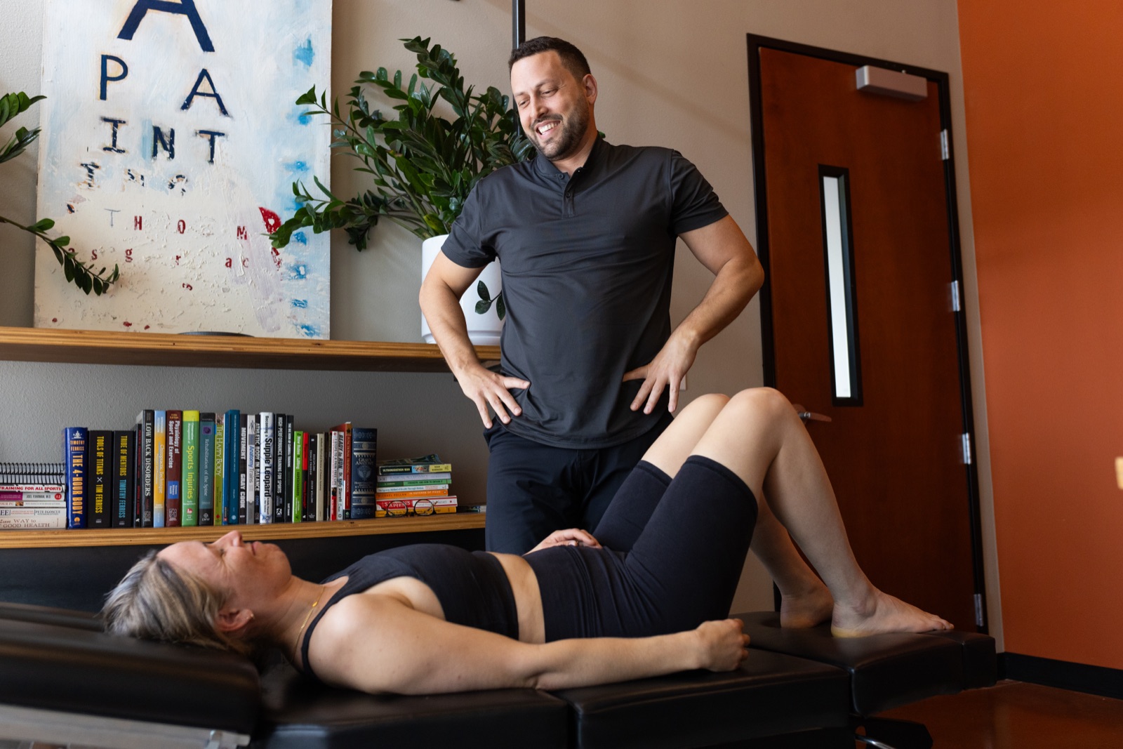 Dr. Q working with a patient in his clinic