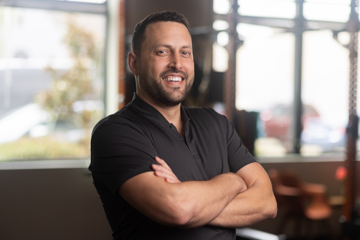 Dr. Q, founder of NarrateRx, in his clinic